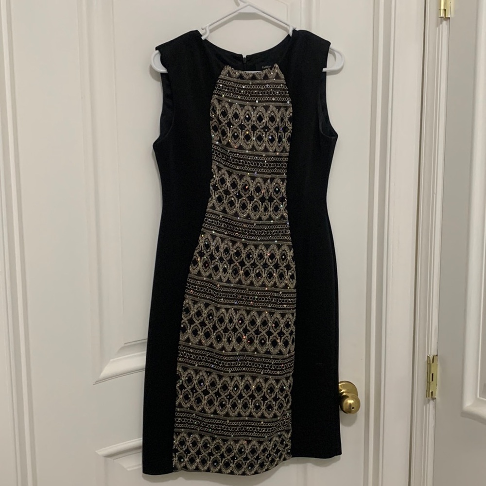 Shiny and beaded black and gold midi dress.